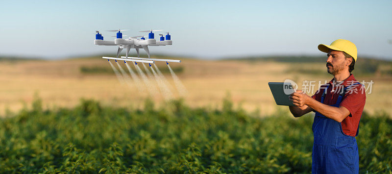 Farmer spraying his crops using a drone